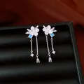 Elegant silver flower earrings with blue zircon and delicate chain tassels detail. - Flower Tassel Style (HE33921) / Silver