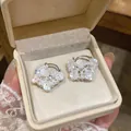 Elegant floral pearl earrings with sparkling rhinestones in a cream jewelry box - Silver