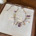 Detailed view of handmade necklace with pearls, purple beads and silver pendants - Beaded Choker (HN12070) / Purple-Silver