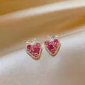 Detailed close-up of strawberry-shaped stud earrings featuring pink and magenta zircons - Strawberry Shape (HE33389-1) / Pink