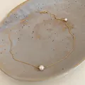 Close-up of a 14k gold plated necklace with a minimalist pearl pendant - Minimalist Single Pearl Style (2#)