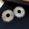 Elegant silver sunburst earrings with bee motif and sparkling rhinestones - Earrings / Silver