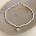 Macro view of a 14k gold plated pearl necklace with a crystal and drop pearl pendant - Square Zirconia Pearl Necklace Style (3#)