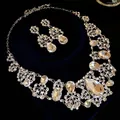 Detailed view of elegant silver jewelry set with crystal flowers and water drops - Necklace Earrings 2-Piece Set / Silver