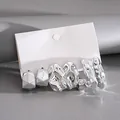 Close-up of 6-piece set of irregular silver metallic stud earrings on display card - 6-Piece Geometric Irregular Style / 6 Pcs Set / Silver