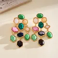 Detailed view of multi-colored geometric resin tassel earrings with gold-toned plating - Gold-Multicolor