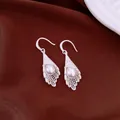 Elegant silver-tone hollow lace cone earrings with white pearl drop detail, high quality - Silver