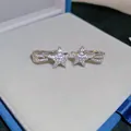 Detailansicht funkelnde Sternschnuppe Silber Zirkon Ohrklemmen ohne Ohrloch Schmuck - 流星五角星耳夹 / 1 Paar Packung / Silber