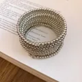 Detailed view of silver multi-layer coiled bracelet with metallic bead texture - Round / Silver
