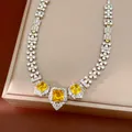 Macro view of palace style square necklace with bright yellow zircons and white crystals - Necklace (HN12364-1) / Choker Necklace / Yellow/Silver