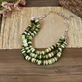 Detailed view of triple-layered green shell bead necklace with silver chain adjustment - Silver-Green