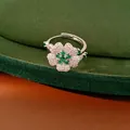 Elegant adjustable silver ring featuring a sparkling floral design with green and clear zircon stones - Ring / Silver-Green