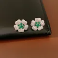 Elegant silver flower stud earrings with emerald green and white cubic zirconia crystals - Earrings / Silver-Green