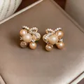Detailed view of elegant gold-tone bow stud earrings with champagne pearls and zircons - Bowknot Pearl Stud Earrings (45#)