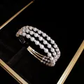 Elegant multi-layer pearl and rhinestone open cuff bracelet presented in a black jewelry box - Triple Layer Open Bangle / Silver