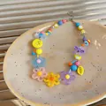 Detailed view of dopamine colorful daisy beaded necklace with various cute charms. - Colorful