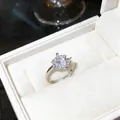 Detailed view of an elegant marquise-cut zircon ring in a white velvet gift box - Silver