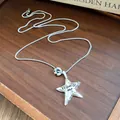 Primo piano collana con ciondolo a stella d'argento, metallo stropicciato e Promise me - Ciondolo Stella in Diaspro Dalmata / Argento