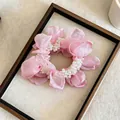 Detailed close-up of a pink chiffon flower scrunchie with elegant white pearl accents - Single Piece / Pink