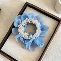 Detailed close-up of a blue chiffon flower scrunchie with white pearl embellishments - Single Piece / Blue
