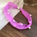 Close-up detail of purple mesh necklace with pearls and rhinestone magnetic clasp - Purple