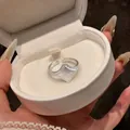Close-up of a silver star-engraved signet ring inside a white round jewelry gift box - Star Seal Open Style (6#) / Silver