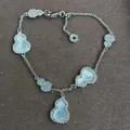 Elegant silver-toned chain bracelet with mother-of-pearl and zircon pavé gourd charms - Silver-Blue