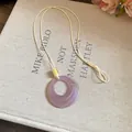 Elegant purple marbled resin donut pendant necklace on cream adjustable cord accessory - Round / Purple