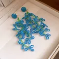 Detailed view of handcrafted blue and green beaded flower tassel earrings in jewelry box - Floral Tassel Style (HE32933) / Blue/Green
