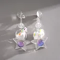 Detailed view of creative resin star earrings featuring a colorful unicorn charm - Silver Post Unicorn Star Style / White/Multicolor