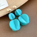 Elegant turquoise blue acrylic double-layered drop earrings with gold-toned studs - Earrings (Silver Earring Post) / Cyan