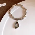 Elegant silver-toned beaded bracelet featuring an irregular faceted grey crystal pendant - Irregular Lava Texture Bracelet / Silver