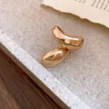 Close-up of gold-finish irregular twisted ring with a droplet design for women. - Irregular Twisted Style (HR3421) / Gold