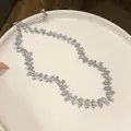 Elegant crystal flower choker necklace detail with silver finish adjustable chain. - Silver Tone White Crystal