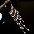 Elegant gold plated pearl tassel ear cuff featuring multiple delicate dangling chains - Single Ear Cuff / Gold