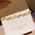 Exquisite detail of real gold-plated flower bracelet featuring yellow and champagne zircons - 49# Bracelet