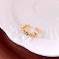 Close-up of elegant gold open ring with blue floral patterns and small white pearls - Real Gold Plated / Gold-Blue