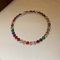 Close-up of a colorful round zircon gemstone bracelet with gold-plated setting - 40# Bracelet