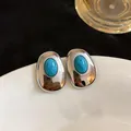 Elegant silver-tone oval stud earrings with turquoise resin inlay for women. - Oval Geometric Style (HE32748) / Silver