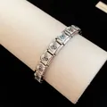 Macro view of stainless steel charm bracelet with cute enamel pug dog pattern details. - Pug Style (TB163) / Silver