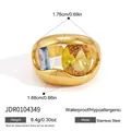 Detail view of gold hollow stainless steel ring with yellow and blue zircon stone specs - Hollow Thick Wall Ring (JDR0104349)