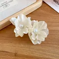 Close-up of elegant fabric flower hair clips with pearl center on wooden background - Duckbill Hair Clips / White