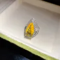 Elegant pear-cut yellow zircon teardrop ring with luxury halo of clear crystals in jewelry box - Yellow
