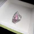 Detail view showing the sparkling pink teardrop zircon and pavé crystal setting on silver ring - Pink