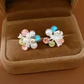 Detail of colorful flower cluster earrings with pearls and rhinestones in a velvet box - Flower Cluster Style (HE34104) / Colorful
