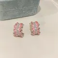 Detailed view of pink enamel C-shape earrings with inlaid cubic zirconia crystals - Pleated C-Shape Style / Silver Pink