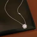Silver-toned rotating flower pendant necklace adorned with shimmering cubic zirconia stones - Silver-White Zirconia
