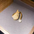 Elegant gold zircon wing open ring featuring delicate pearls in a luxury display box - Star Wing Style (HR3432)