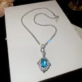 Close-up of vintage blue zircon pendant necklace with brilliant crystal tennis chain. - Silver-Blue