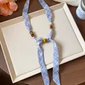 Chiffon printed plaid scarf necklace with decorative wooden beads and ceramic accents - Blue
